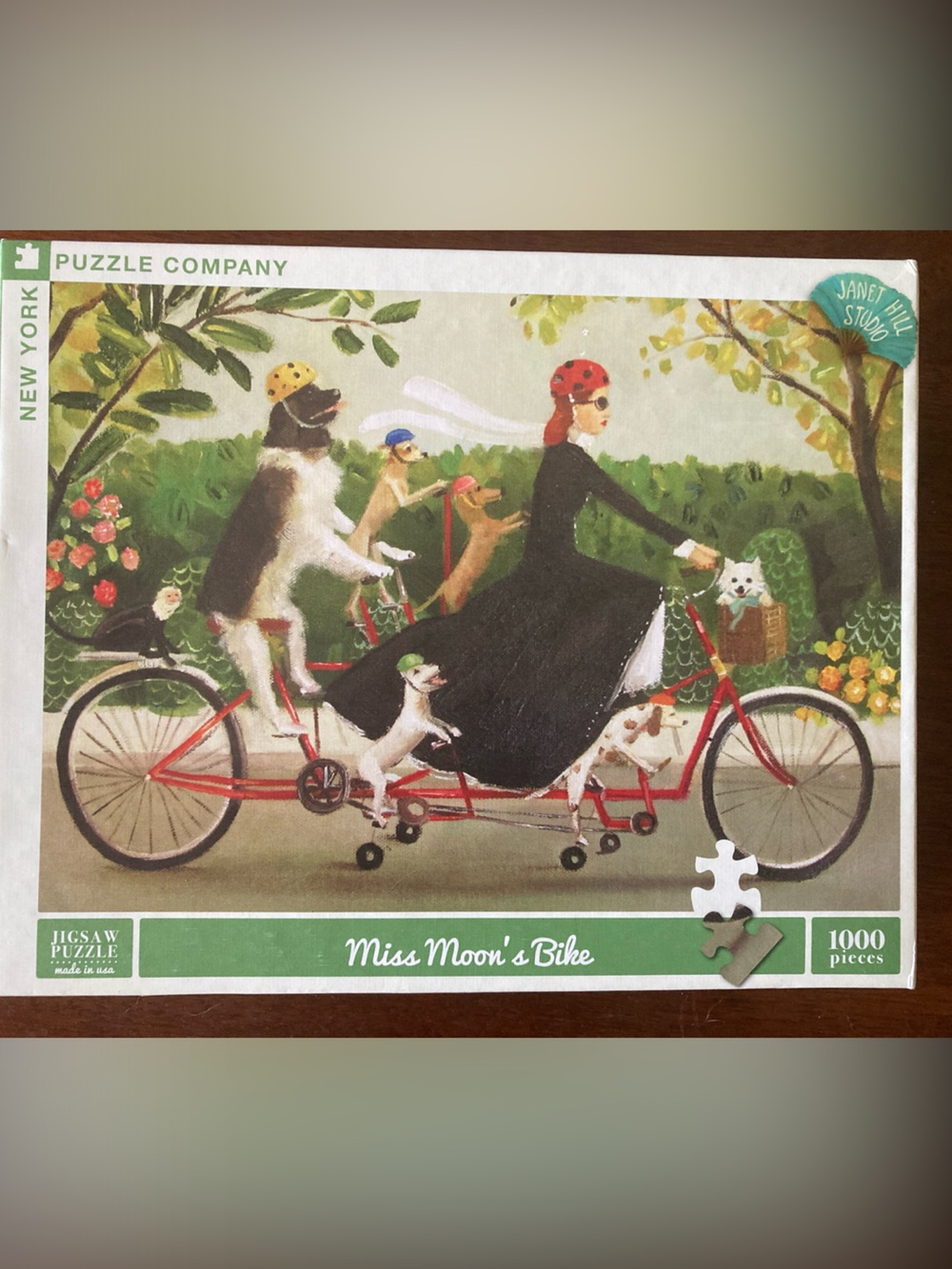 New York Puzzle Company "Miss Moon's Bike" 1000-Piece Jigsaw Puzzle